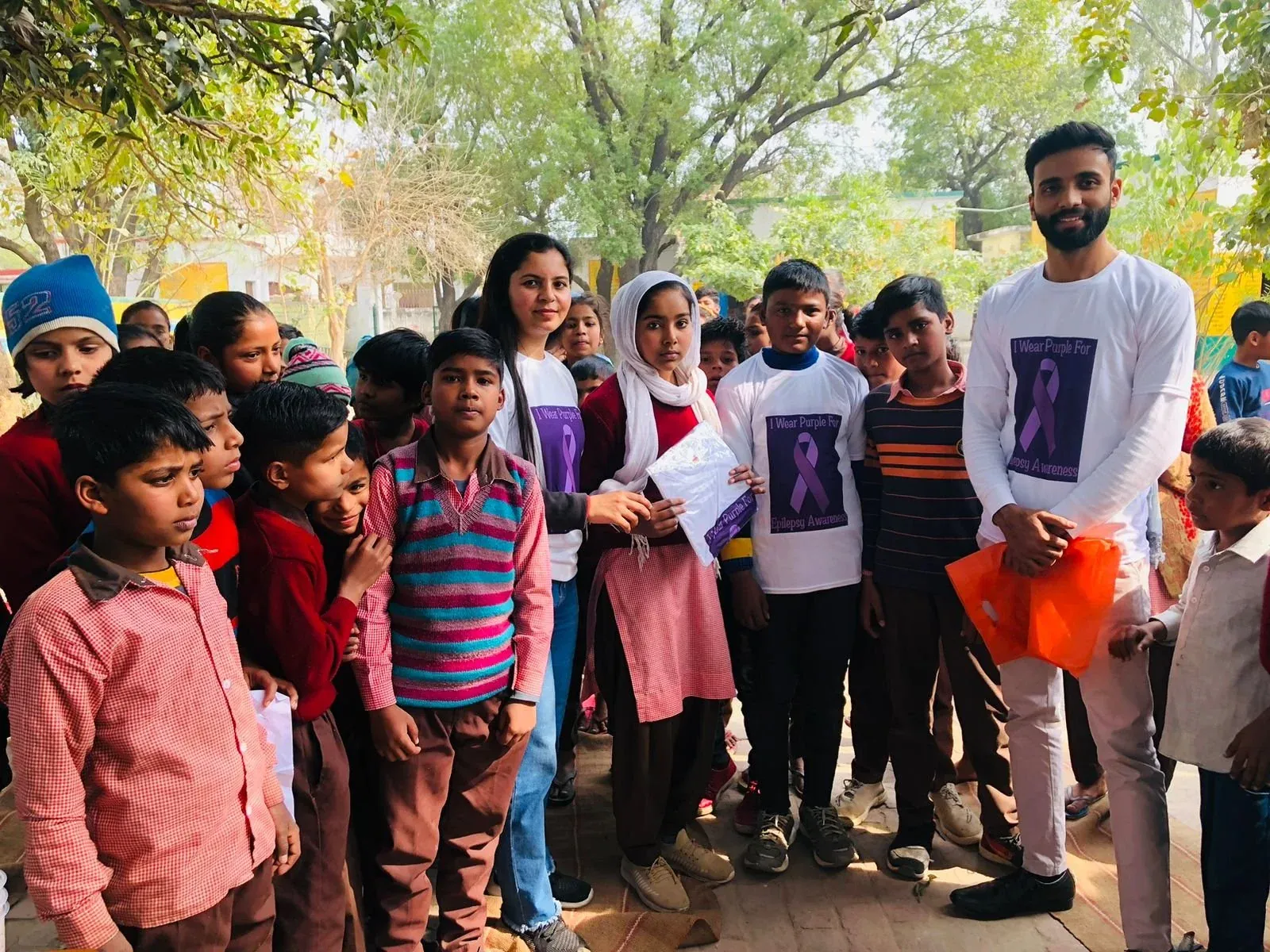 Students in Delhi wearing shirts that read I wear purple for epilepsy awareness